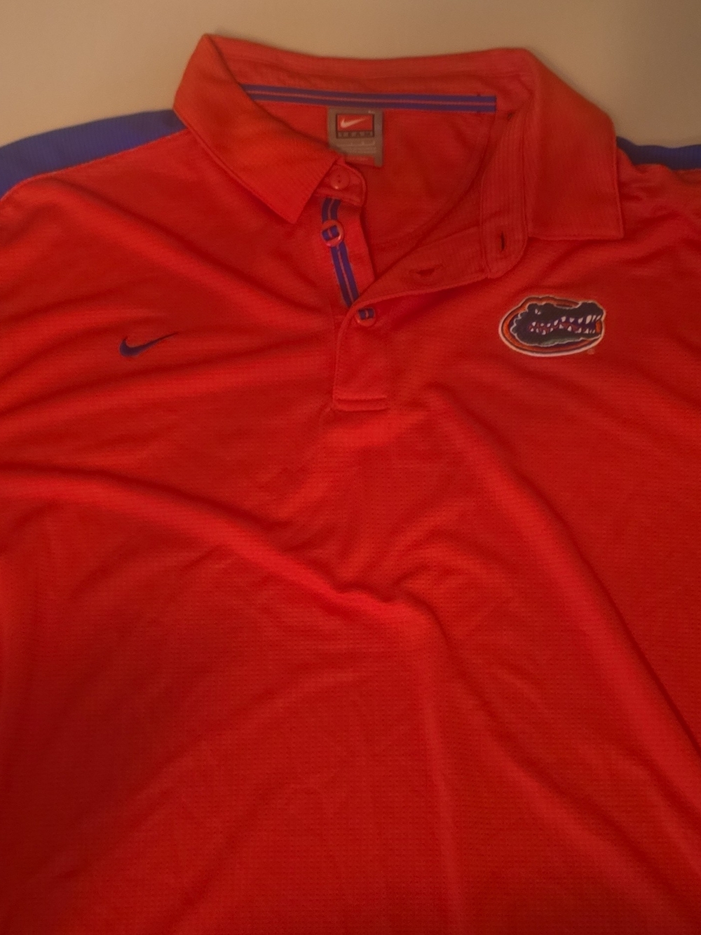 Nike Men’s Orange Polo with Blue Accents and Gators Logo